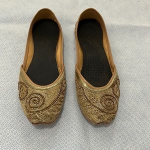 Embellished gold loafers